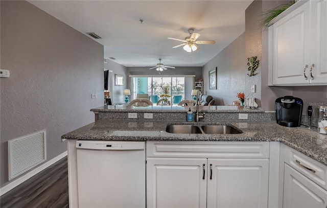 kitchen featuring white cabinetry, dishwasher, sink, kitchen peninsula, and stone countertops