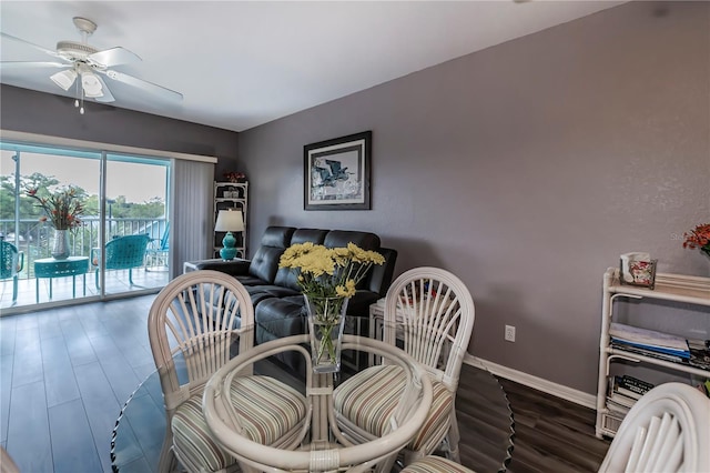 dining room featuring ceiling fan and dark wood-type flooring