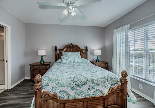 bedroom with ceiling fan and dark wood-type flooring