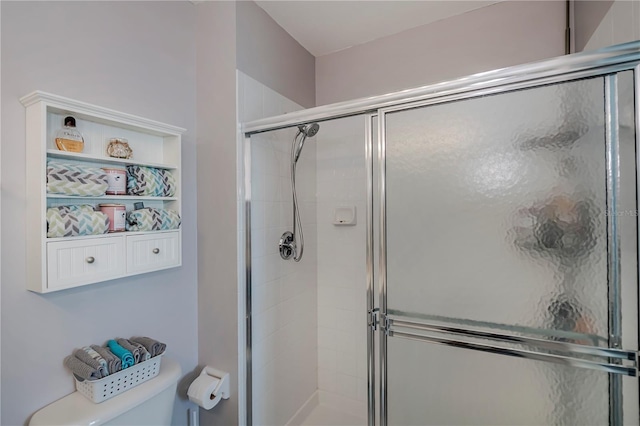 bathroom with a shower with shower door