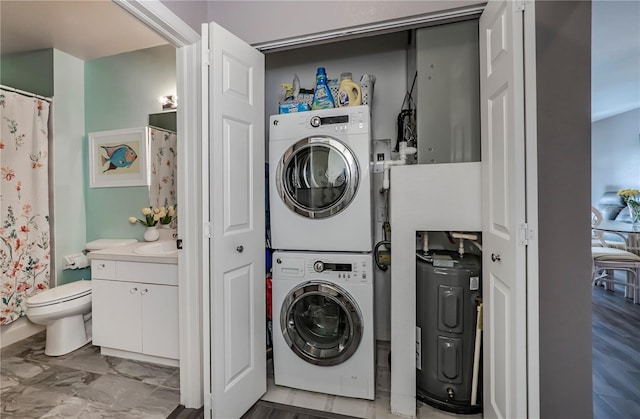 washroom with stacked washing maching and dryer