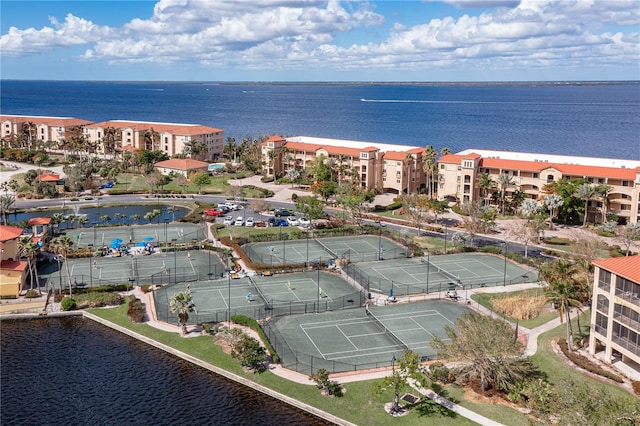 birds eye view of property with a water view