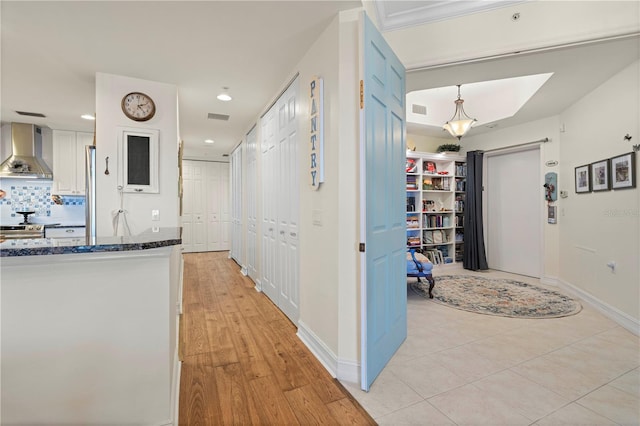 hall with light hardwood / wood-style floors