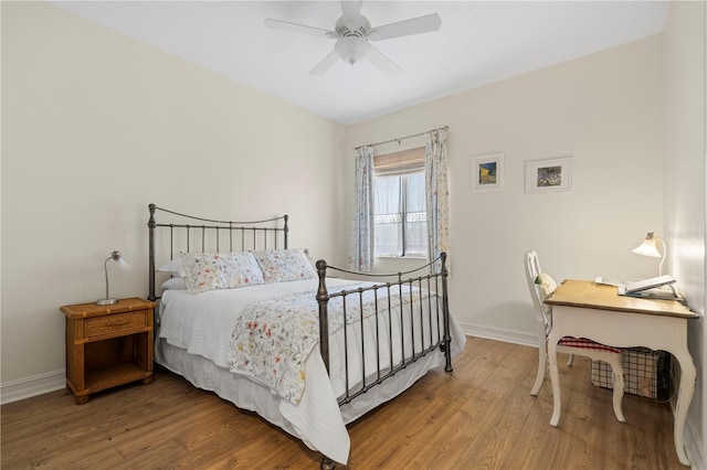 bedroom featuring hardwood / wood-style flooring and ceiling fan