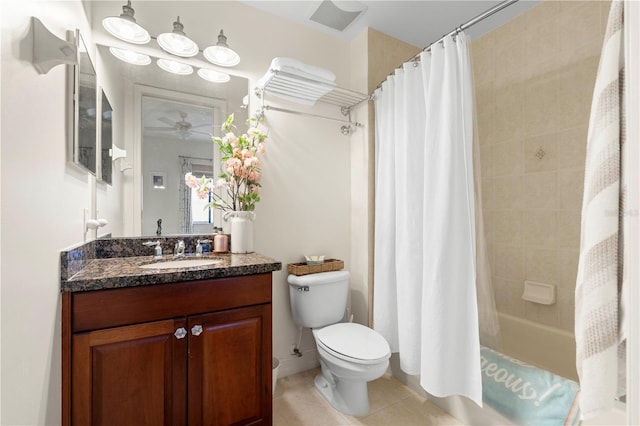 full bathroom with ceiling fan, tile patterned flooring, shower / bath combination with curtain, toilet, and vanity