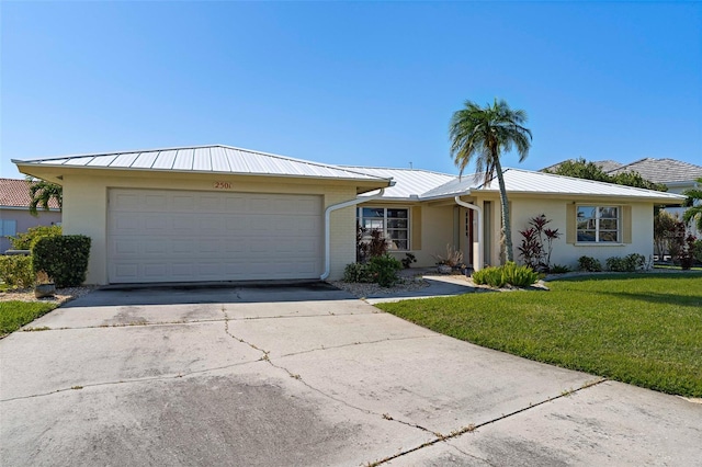 single story home featuring a garage and a front lawn