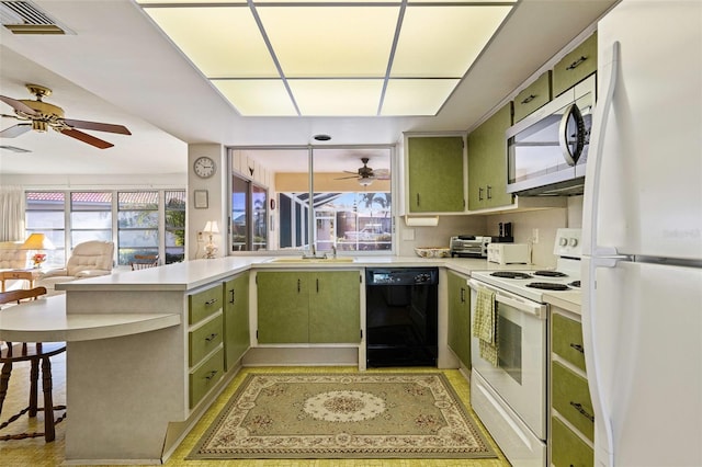 kitchen with a kitchen bar, white appliances, kitchen peninsula, and green cabinetry