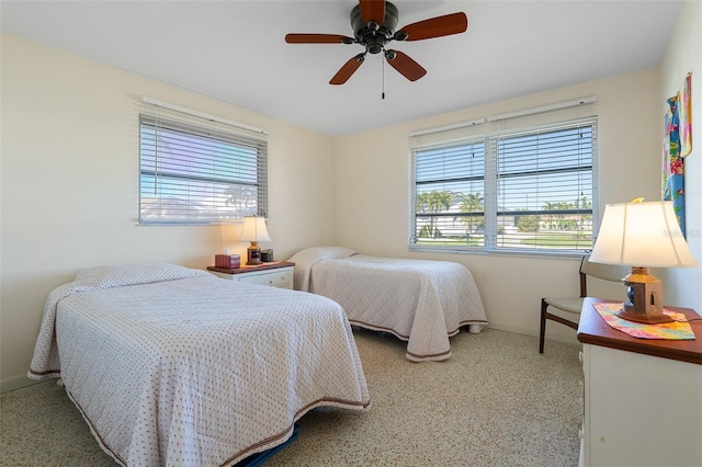 bedroom with carpet, multiple windows, and ceiling fan