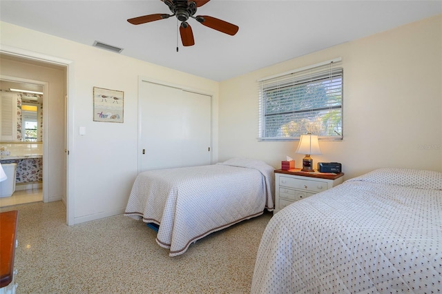 bedroom featuring multiple windows, a closet, and ceiling fan