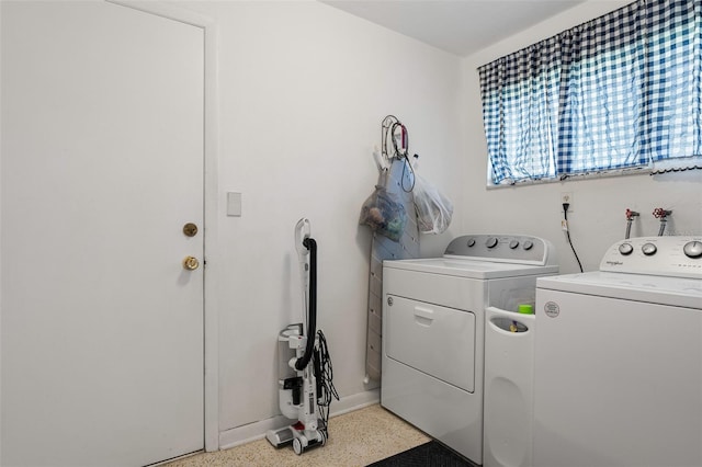 laundry area featuring washing machine and clothes dryer