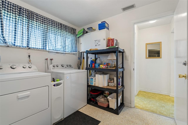 washroom featuring washer and clothes dryer