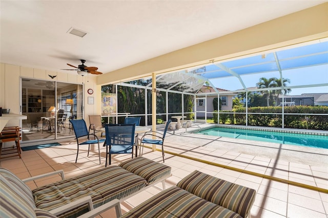 view of swimming pool with an outdoor hangout area, a lanai, a patio area, and ceiling fan