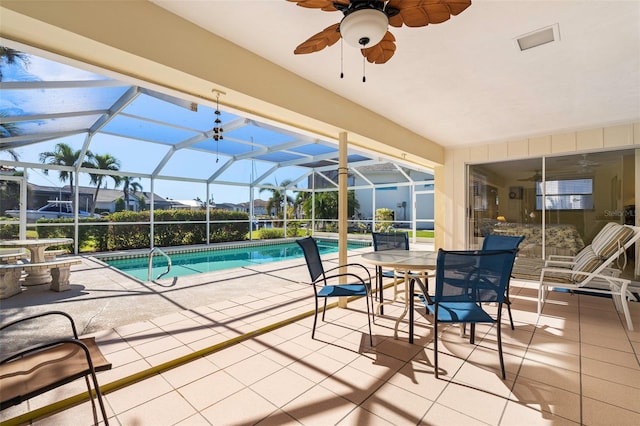 view of pool with a patio area and a lanai