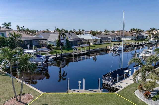 dock area featuring a water view and a yard