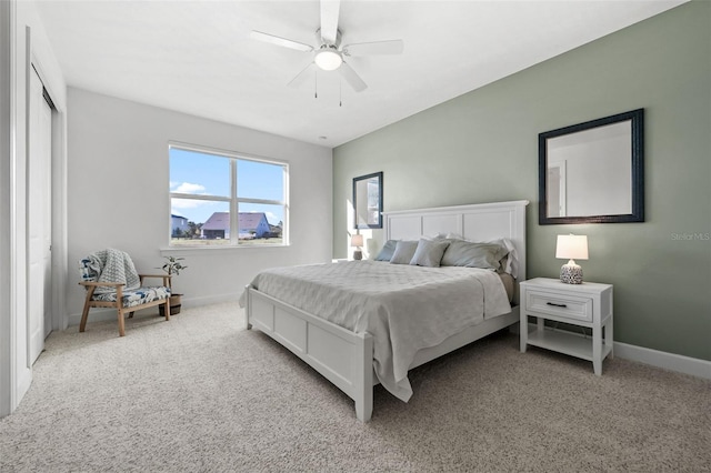 carpeted bedroom with ceiling fan