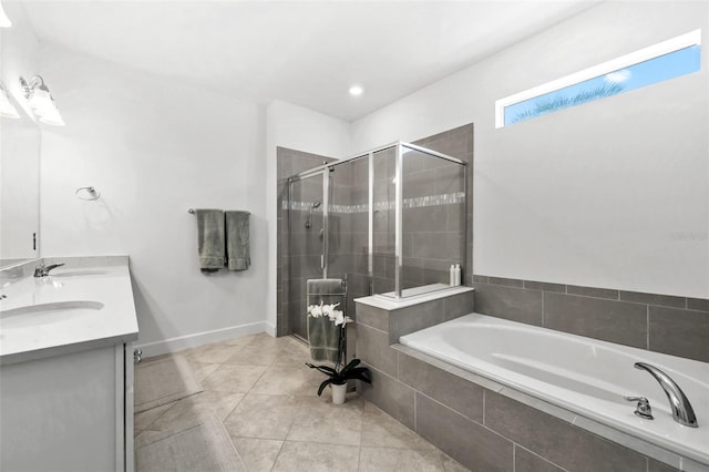 bathroom with tile patterned flooring, vanity, and separate shower and tub