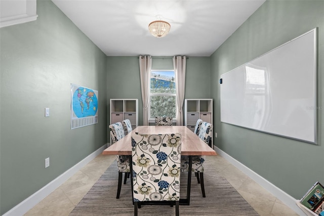 dining space featuring a chandelier