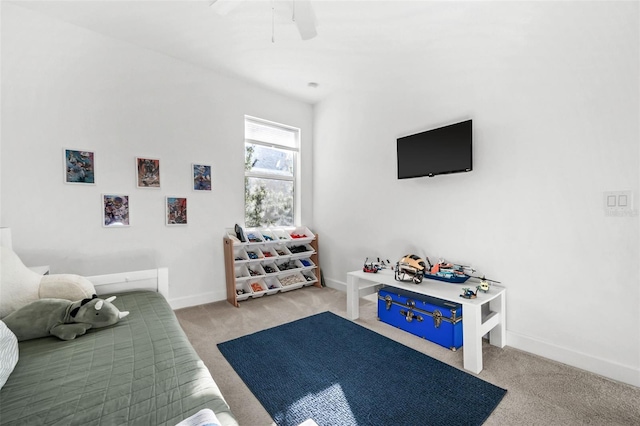 interior space with light carpet and ceiling fan