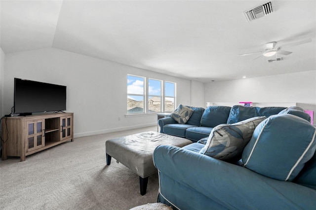 carpeted living room with ceiling fan and vaulted ceiling