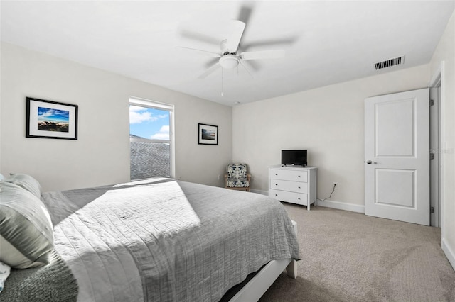 bedroom featuring ceiling fan and light colored carpet