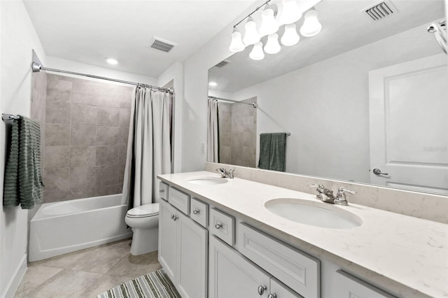 full bathroom featuring tile patterned floors, shower / tub combo with curtain, vanity, and toilet