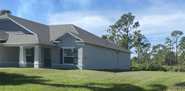 view of property exterior featuring a yard