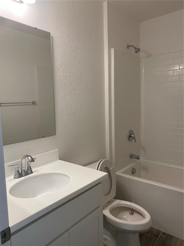 full bathroom with vanity, toilet, shower / bath combination, and wood-type flooring