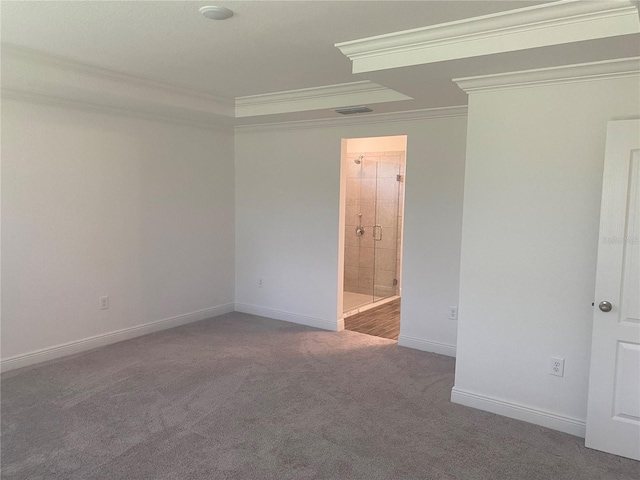 empty room featuring carpet floors and ornamental molding