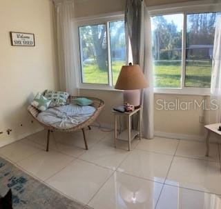 living area featuring tile patterned flooring