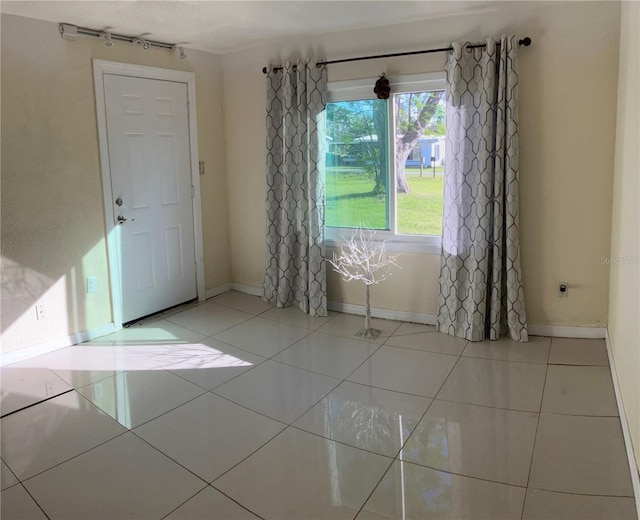 spare room with light tile patterned floors