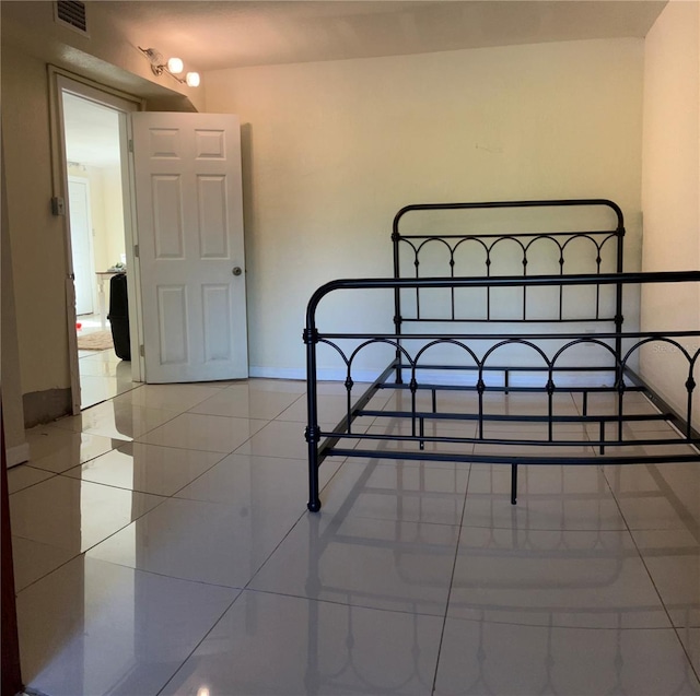 bedroom featuring tile patterned flooring