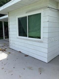 view of side of home featuring a patio area