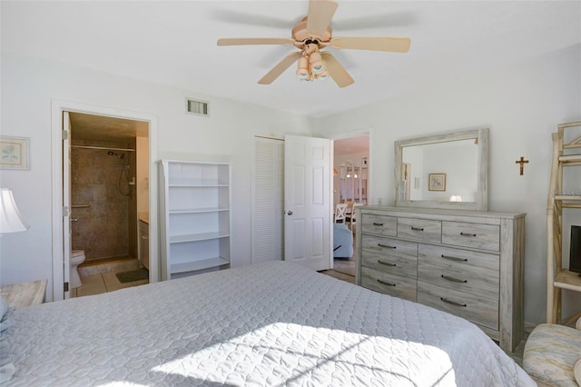 bedroom featuring ensuite bath and ceiling fan