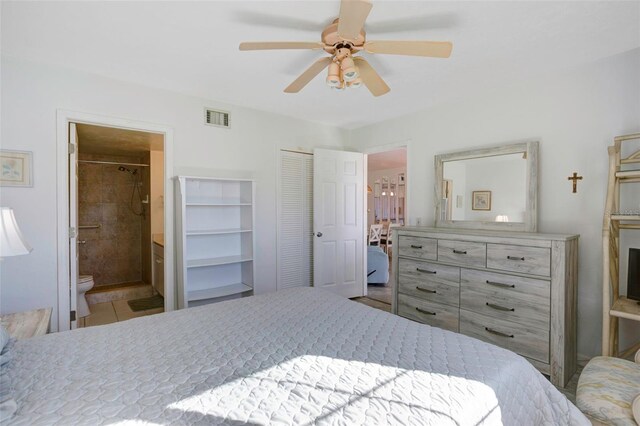 3310 Loveland Blvd Unit 2304, Punta Gorda, FL 33980 - bedroom with connected bathroom, ceiling fan, and a closet