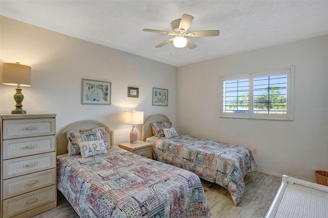 bedroom featuring light hardwood / wood-style flooring and ceiling fan