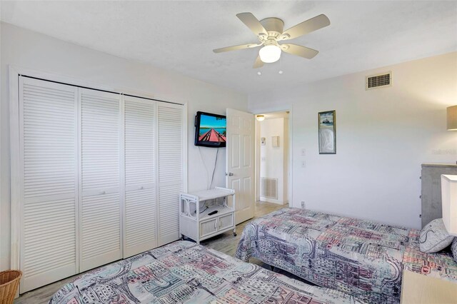 3310 Loveland Blvd Unit 2304, Punta Gorda, FL 33980 - bedroom featuring a closet, light wood-style floors, and ceiling fan