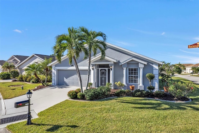 view of front of house featuring a garage and a front lawn