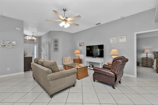 living room featuring light tile patterned floors and ceiling fan with notable chandelier