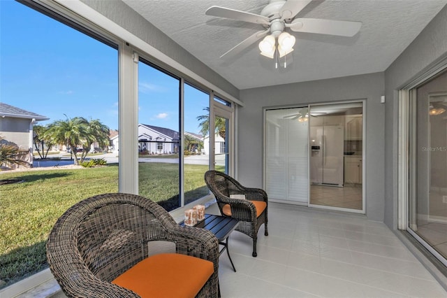 sunroom / solarium with ceiling fan