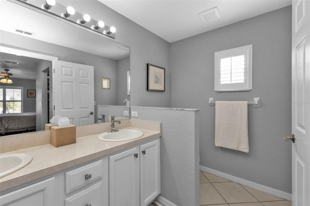 bathroom with tile patterned flooring, ceiling fan, and vanity