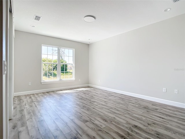 spare room featuring light hardwood / wood-style flooring