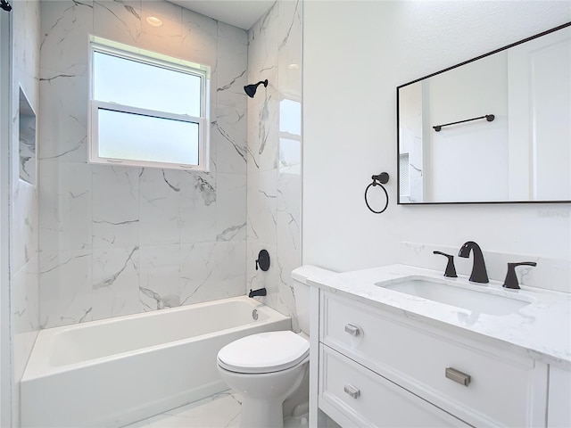 full bathroom with vanity, toilet, and tiled shower / bath