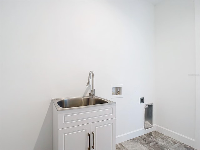 laundry room with hookup for an electric dryer, washer hookup, cabinets, and sink