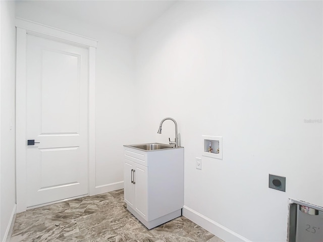 clothes washing area featuring cabinets, washer hookup, electric dryer hookup, and sink