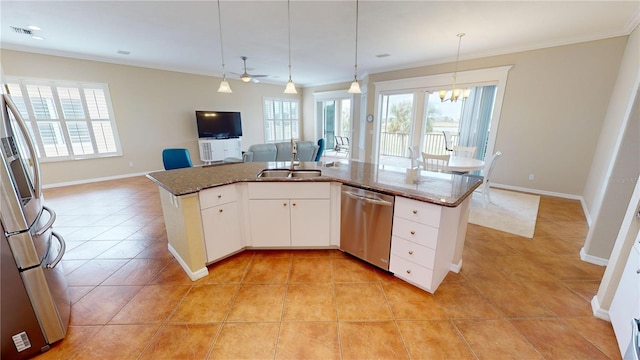 kitchen featuring stainless steel appliances, white cabinetry, plenty of natural light, and sink