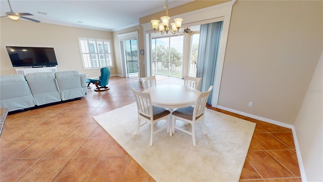 dining room with tile patterned floors, ceiling fan with notable chandelier, and crown molding