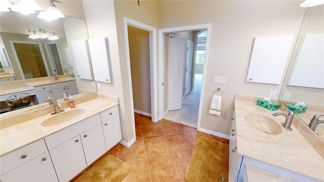 bathroom with tile patterned floors and vanity