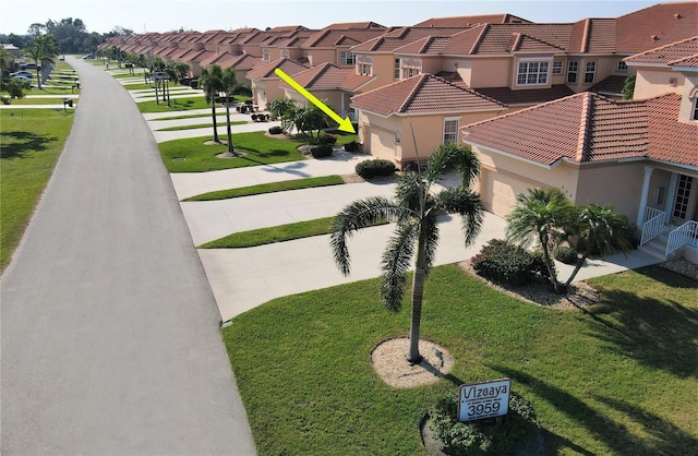 view of property's community with a yard