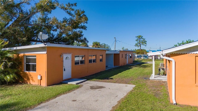 view of outbuilding with a yard