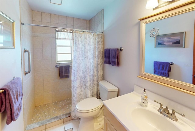 bathroom featuring tile patterned flooring, vanity, curtained shower, and toilet